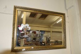 20TH CENTURY WALL MIRROR DECORATED WITH AN ETCHED DESIGN OF HORSE AND CARRIAGE, GILT FRAMED