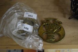 SMALL BAG CONTAINING THREE HORSE BRASSES