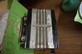 HAND HELD SILVER MONARCH ACCORDION