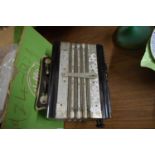 HAND HELD SILVER MONARCH ACCORDION