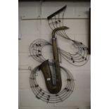 METAL WALL HANGING FORMED AS A SAXOPHONE