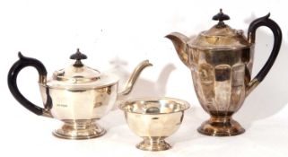 George V silver three piece tea set comprising tea pot with ebonised handle and hinged lid,