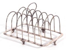 George III silver double toast rack of rectangular form with seven wire dividers and central loop