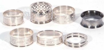 Mixed Lot of seven hallmarked silver serviette rings, various dates and makers, 101.4gms