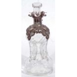Small late Victorian glass spirit decanter of ‘hour-glass’ form, having applied ornate lattice
