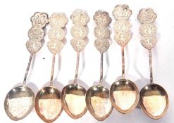 Cased Edward VII set of six silver Old English pattern tea spoons with bright cut decoration,