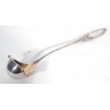 Continental white metal punch ladle in Art Nouveau taste, having Iris embossed pointed handle, the