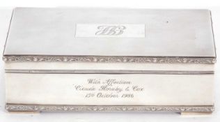 Hallmarked silver table cigarette box of rectangular form, engine turned lid to a single division