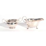 Mixed Lot: George V silver sauce boat with card cut rim, scroll handle, engraved with initial 'H',