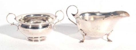 Mixed Lot: George V silver sauce boat with card cut rim, scroll handle, engraved with initial 'H',