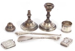 Mixed Lot: Edwardian silver vesta, a white metal vesta stamped 800, a pair of dwarf candlesticks (