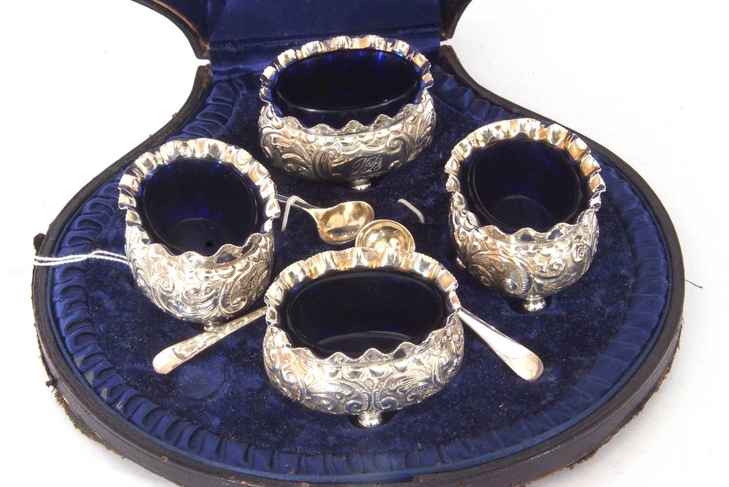 Set of four late Victorian silver four-footed salts of oval form with floral decoration and - Image 3 of 3