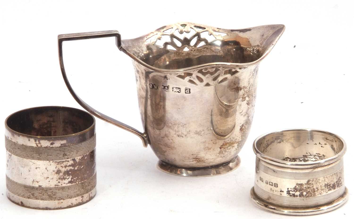 Edward VII silver cream jug, helmet shaped with pierced design, reeded angular handle to an oval - Image 2 of 3