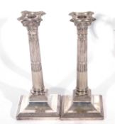 Pair of silver plated Corinthian column candlesticks with detachable beaded sconces on loaded