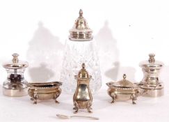 Mixed Lot:Two Elizabeth II silver cased pepper and salt mills,(one hallmarked) London 1992, maker'