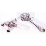 Mixed Lot of babies rattles comprising a silver example with three bells and mother of pearl