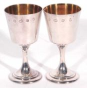 Pair of Elizabeth II silver goblets with gilt interiors, oversized hallmarks London 1977, 12.5cm