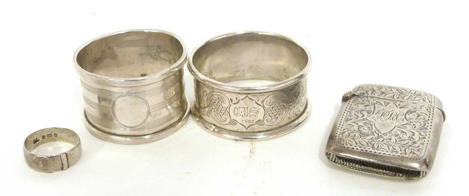 Two serviette rings, a vesta etc