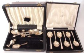 Cased set of six Elizabeth II fruit spoons in Art Deco taste with stylised handles and egg shaped