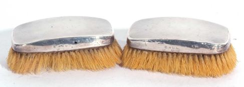 Pair of George VI silver backed clothes brushes with engine turned decoration, Birmingham 1938,