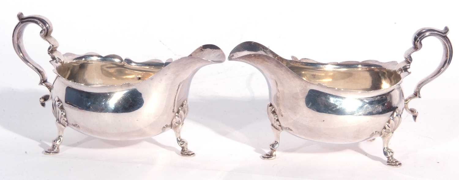 Large pair of George V silver sauce boats, each having card cut rims, capped scroll handles and - Image 2 of 4