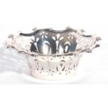 Edward VII silver bon-bon dish of circular form, scroll border with pierced geometric design