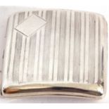 George V silver cigarette case of shaped square form, with engine turned decoration back and