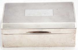 George VI silver table cigarette casket, engine turned decoration with a rectangular vacant