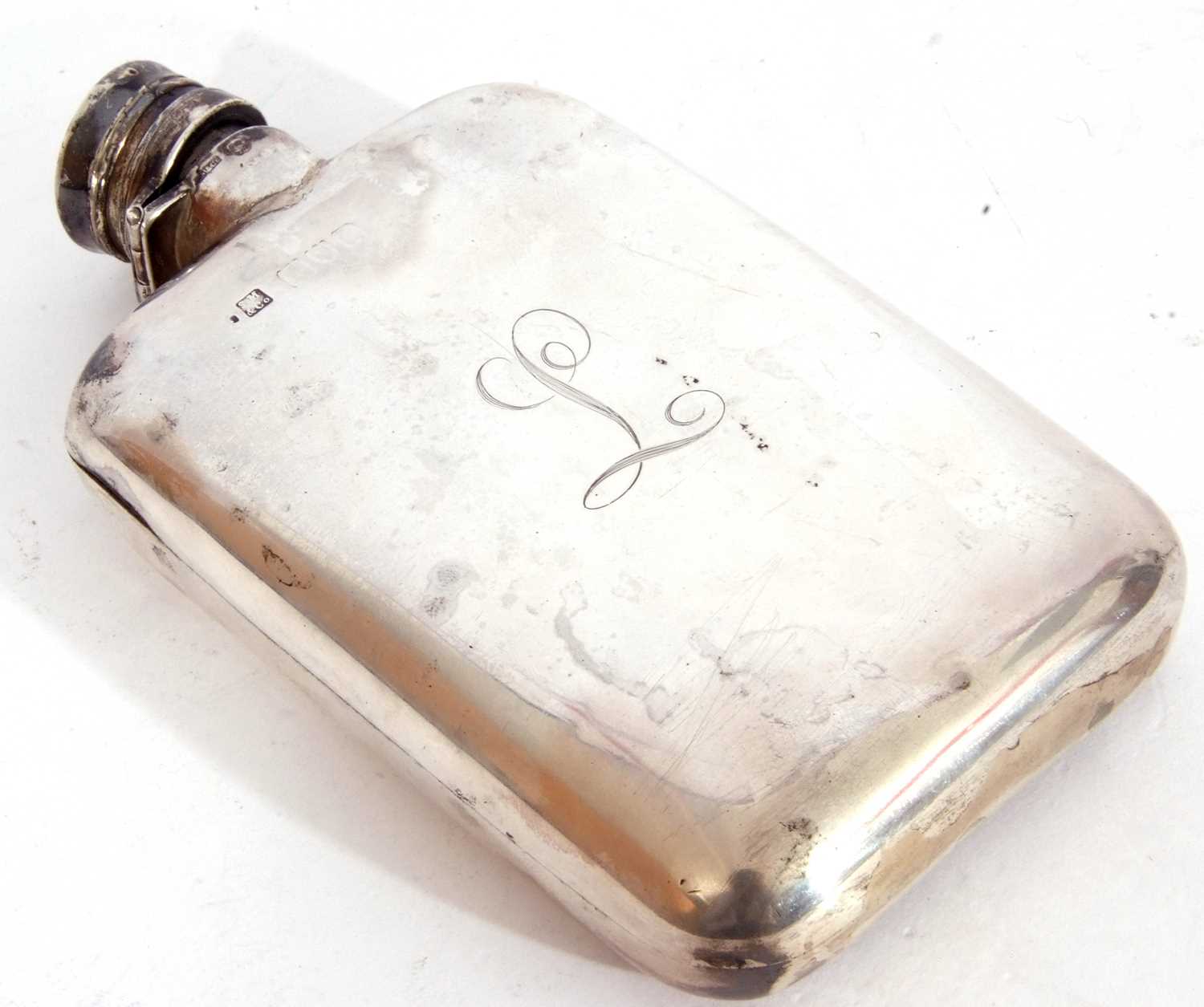 Early 20th century silver hip flask, circa 1920, of rectangular curved form with rounded corners,