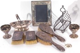 Box of miscellaneous to include two silver backed brushes, silver photograph frame 18 x 13cm and a