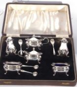 Cased George VI condiment set comprising two mustards and liners, two peppers, two open salts and