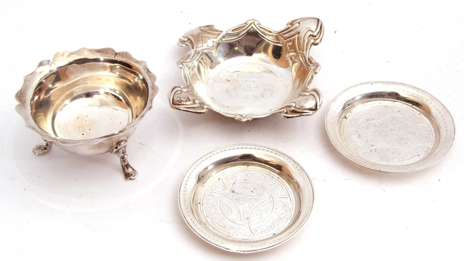 Mixed Lot: Edward VII silver bowl of squat circular form with card cut wavy rim standing on three