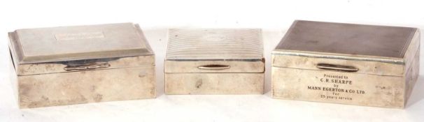 Mixed Lot: three silver mounted and wood lined cigarette boxes of hinged form, decorated with