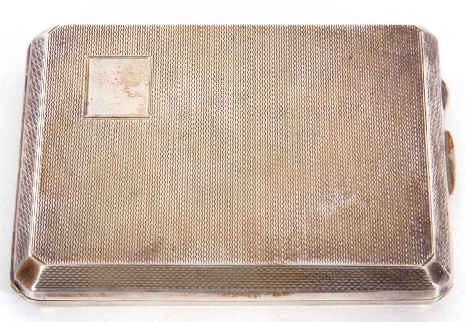 George VI silver cigarette case of rectangular form with a plain corner set cartouche, engine turned