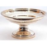 George V silver pedestal fruit bowl with a pierced geometric section, gadrooned rims, standing on