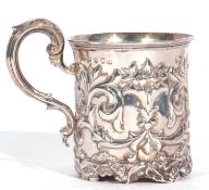 Scottish silver mug of cylindrical form, elaborately embossed with flowers and scrolls around an