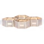 Set of four George VI napkin rings of compressed hexagonal form, all over banded engine turned