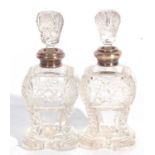Pair of George V glass scent bottles and stoppers, each with a silver collar, London 1922, maker's