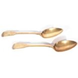 Pair of William IV silver gilt Fiddle pattern table spoons, the front of the handle hand engraved