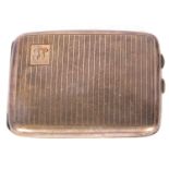 George V silver cigarette case of rectangular curved form, one corner engraved with a cartouche
