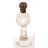 Cut glass dressing table scent bottle with pull off embossed white metal lid, 17cm tall