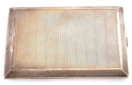 George V silver cigarette case of rectangular form, engine turned decoration, side full length