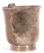 Hallmarked silver small mug, baluster form with reeded handle and foot, engraved "Clare Elaine", 7cm