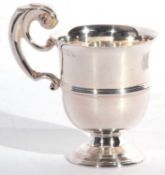 Irish silver mug, the body with tapered sides, reeded mid-section to a spreading circular foot