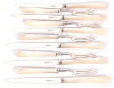 Six silver bladed and mother of pearl knives and five three-prong matching forks, Sheffield 1927,