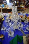 CONTEMPORARY NINE BRANCH CHANDELIER WITH GLASS PRISMATIC DROPS