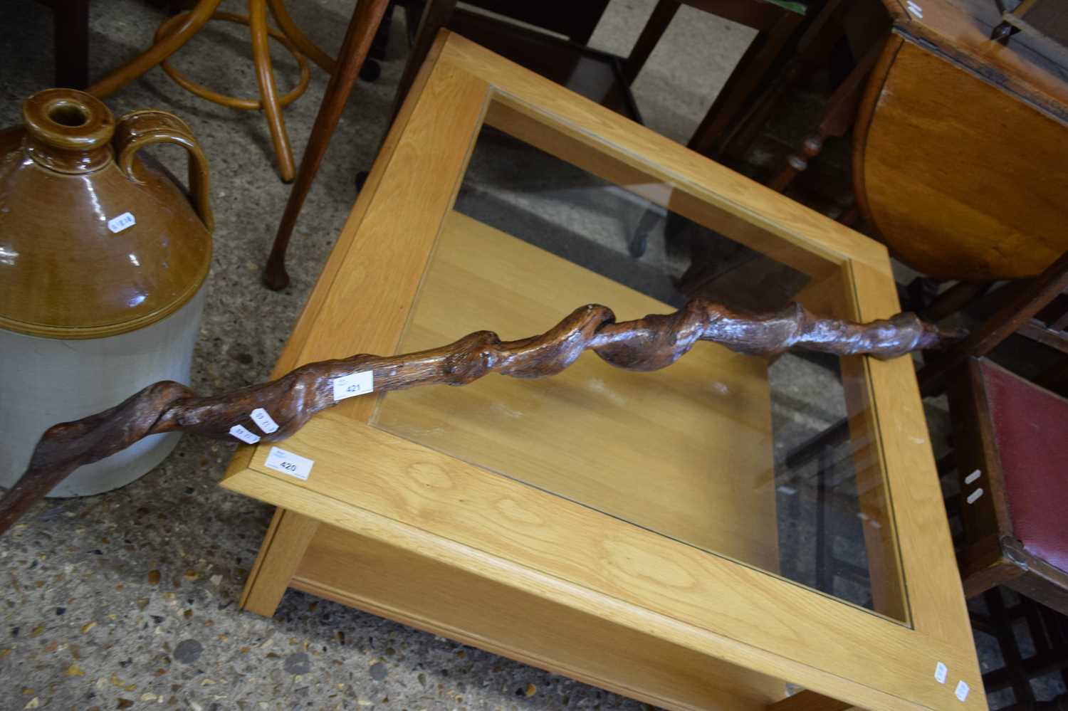 UNUSUAL WALKING STICK FORMED FROM A KNARLED TWISTED PIECE OF WOOD