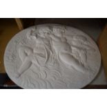 OVAL PLASTERWORK WALL PLAQUE DECORATED WITH PUTTO