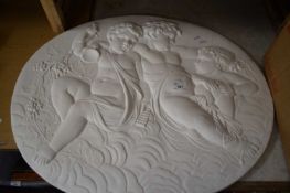 OVAL PLASTERWORK WALL PLAQUE DECORATED WITH PUTTO