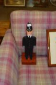 PAINTED WOODEN MODEL OF A POLICEMAN